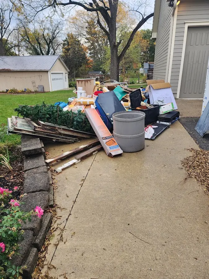 Dumpster being loaded with debris for Commercial Dumpster Rental in San Benito